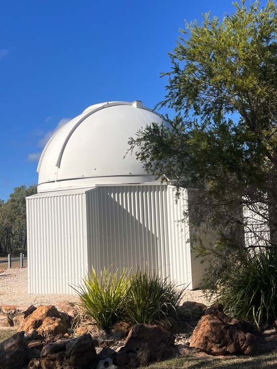 Small ovservatory beneach a dark outback sky in Rubyvale during Ella and Jo's Queensland gemfields road trip, with telescopes, stars and winter night sky viewing.